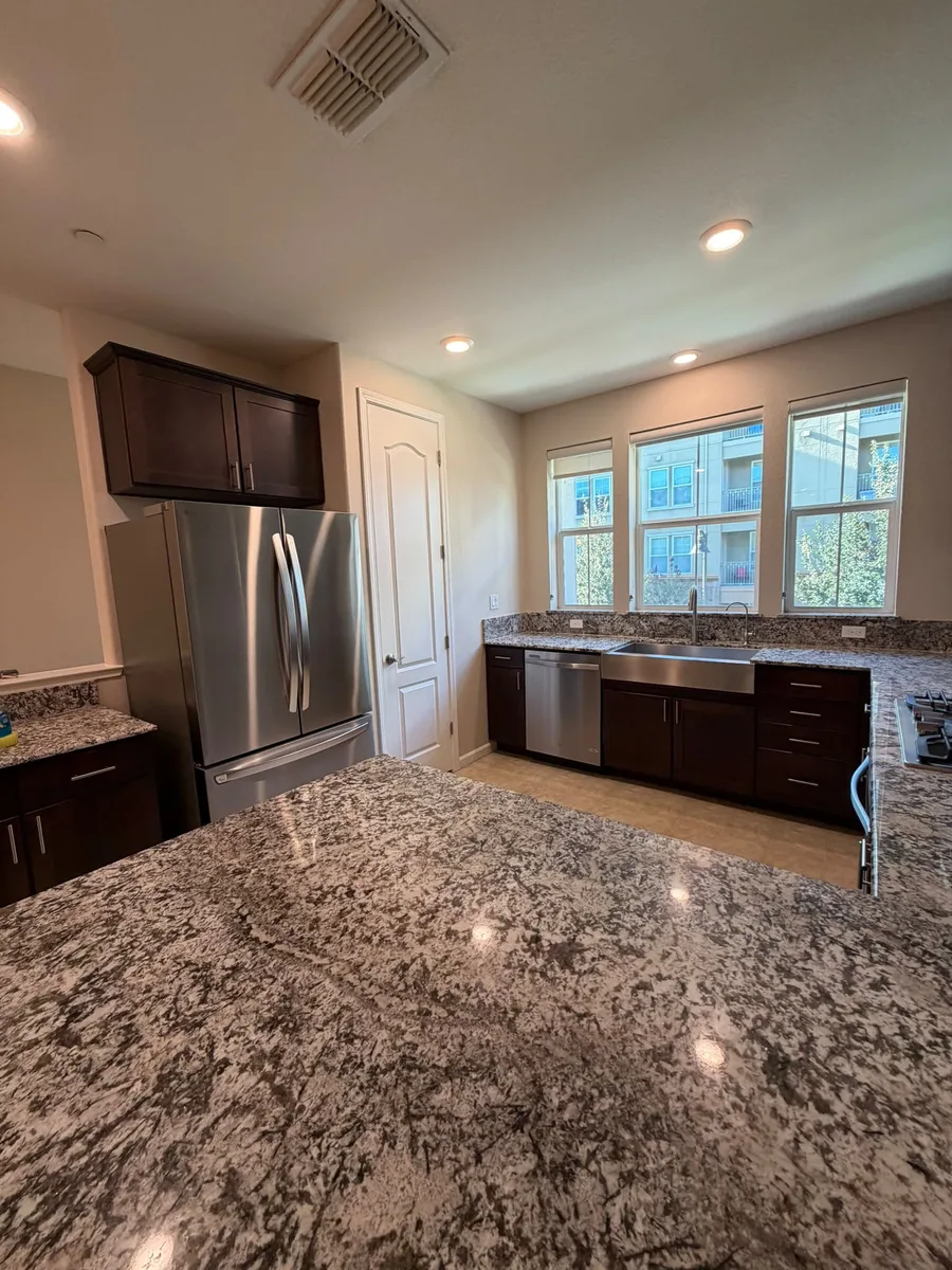 Clean kitchen with polished granite countertops
