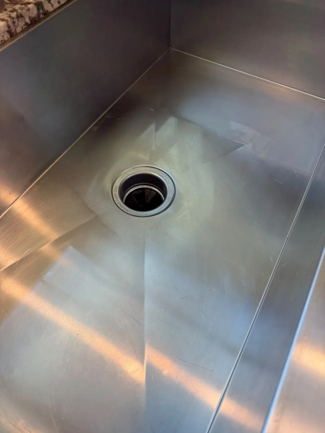 Polished stainless steel sink